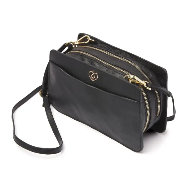 Stylish leather shoulder bag for diabetics with multiple compartments, adjustable strap, and secure closure for organizing diabetic supplies.