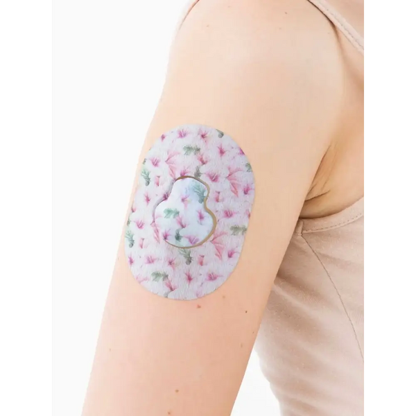 Floral-patterned Guardian Enlite adhesive patches offering secure hold for glucose monitoring