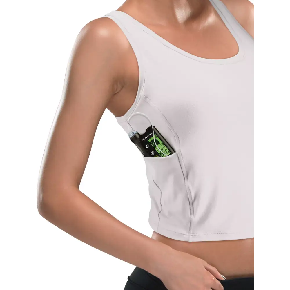 Adaptive woman's crop top with integrated insulin pump pocket, designed for comfort and style.