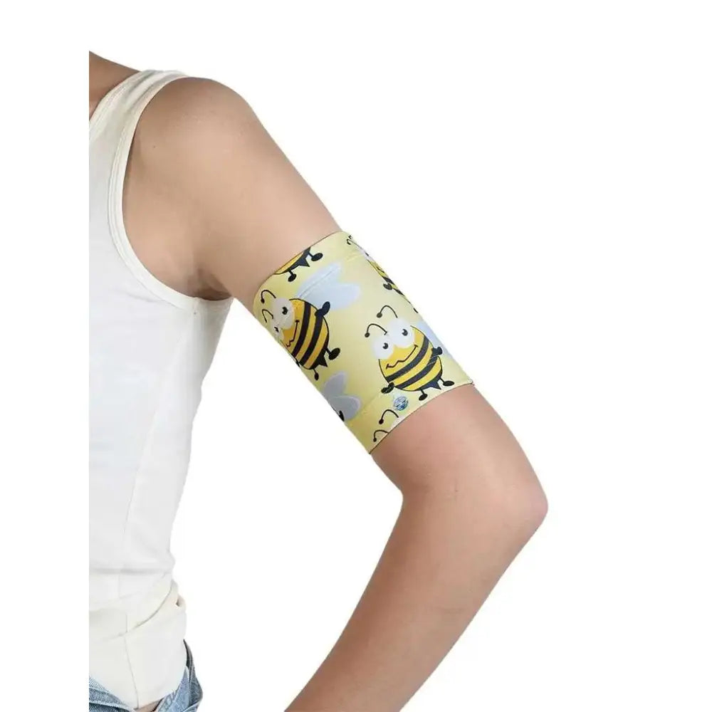 Blood Glucose Sensor Armband for Children in Fauna & Flora design worn on arm.