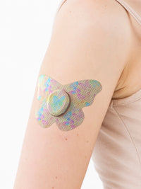 Fixierpflaster für Dexcom G7, Form Schmetterling, am Arm, Nahaufnahme