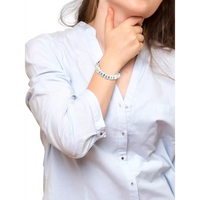 Diabetic bracelet on a woman's wrist, symbolizing diabetes awareness and support.