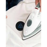 Diabetes awareness iron-on patch being applied to clothing with an iron, featuring a Viking-themed design.