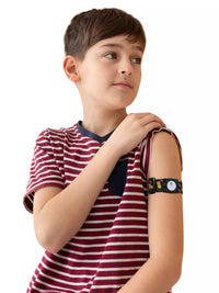 Child wearing Freestyle Libre 3 armband, Dia-Style Kiddy design, on arm for comfortable diabetes care.