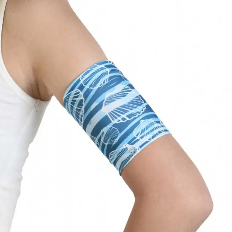 Glucose sensor armband with sea and beach design for insulin pump protection.