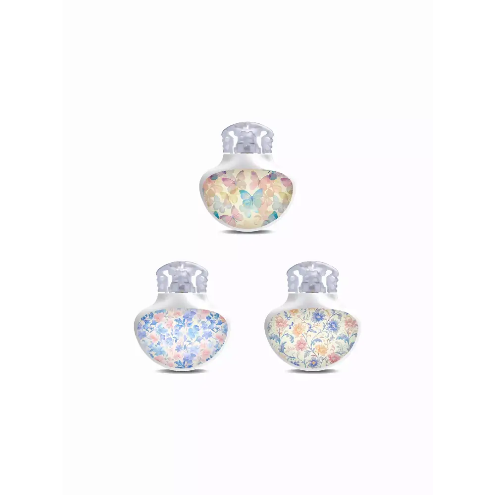 Set of three Guardian Enlite Stickers featuring pastel butterflies and floral designs with a vinyl-laminated, waterproof finish for sensor protection and style.