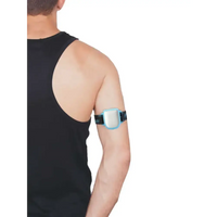 Omnipod insulin patch pump adjustable armband with blue clip worn on upper arm.