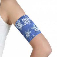 Glucose sensor armband sea and beach edition with blue turtle design.