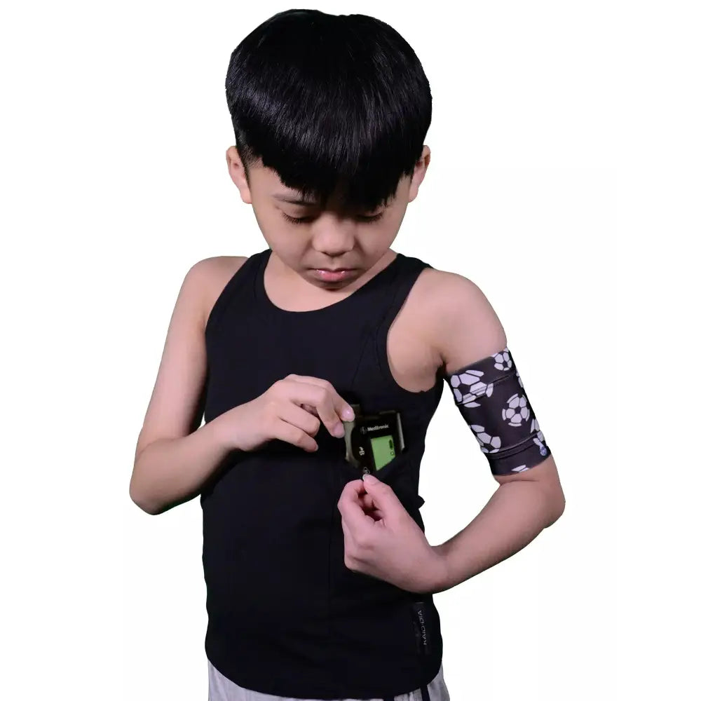 Tank top for children using an insulin pump with integrated pockets.